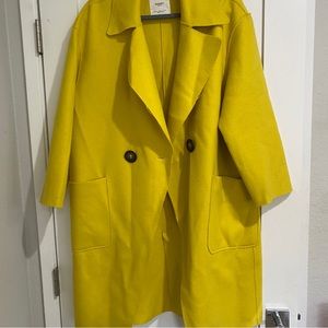 woman’s yellow wool coat